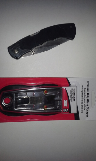 Utility knife; straight edge razor/glass scraper. I’ve got a box cutter somewhere, but it’s not in my toolbox.